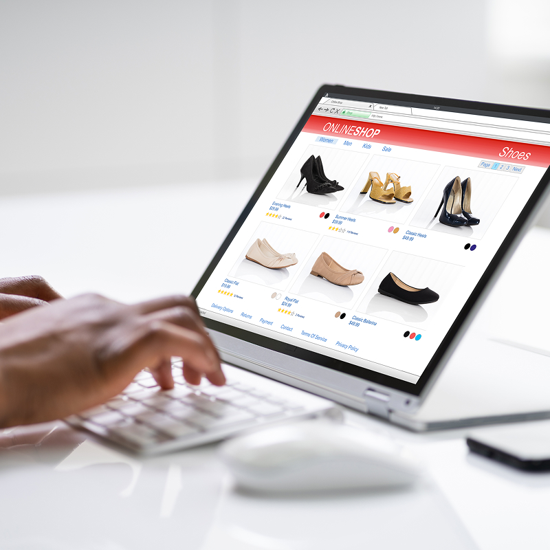 shutterstock_1769702870-img Woman shopping on convertible laptop