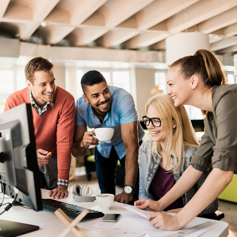 Team of young professionals collaborating in a modern startup office