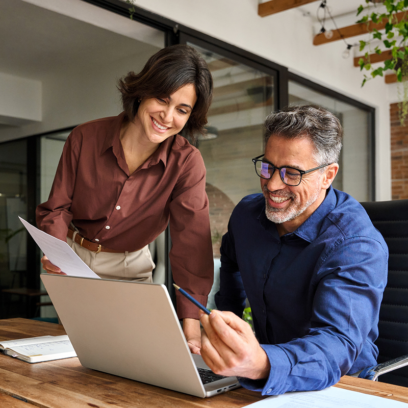 Two business professionals having a meeting in an office setting